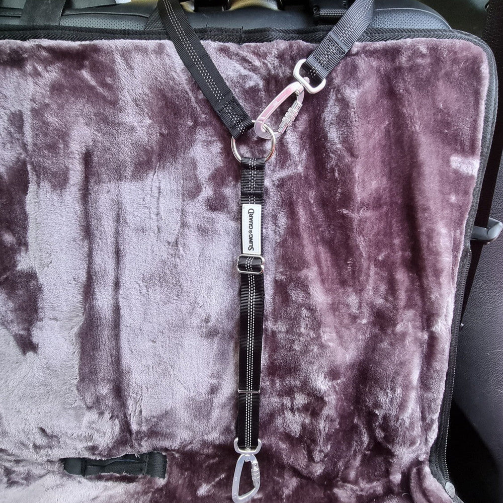 Car seat cover with a harness on a vehicle's back seat