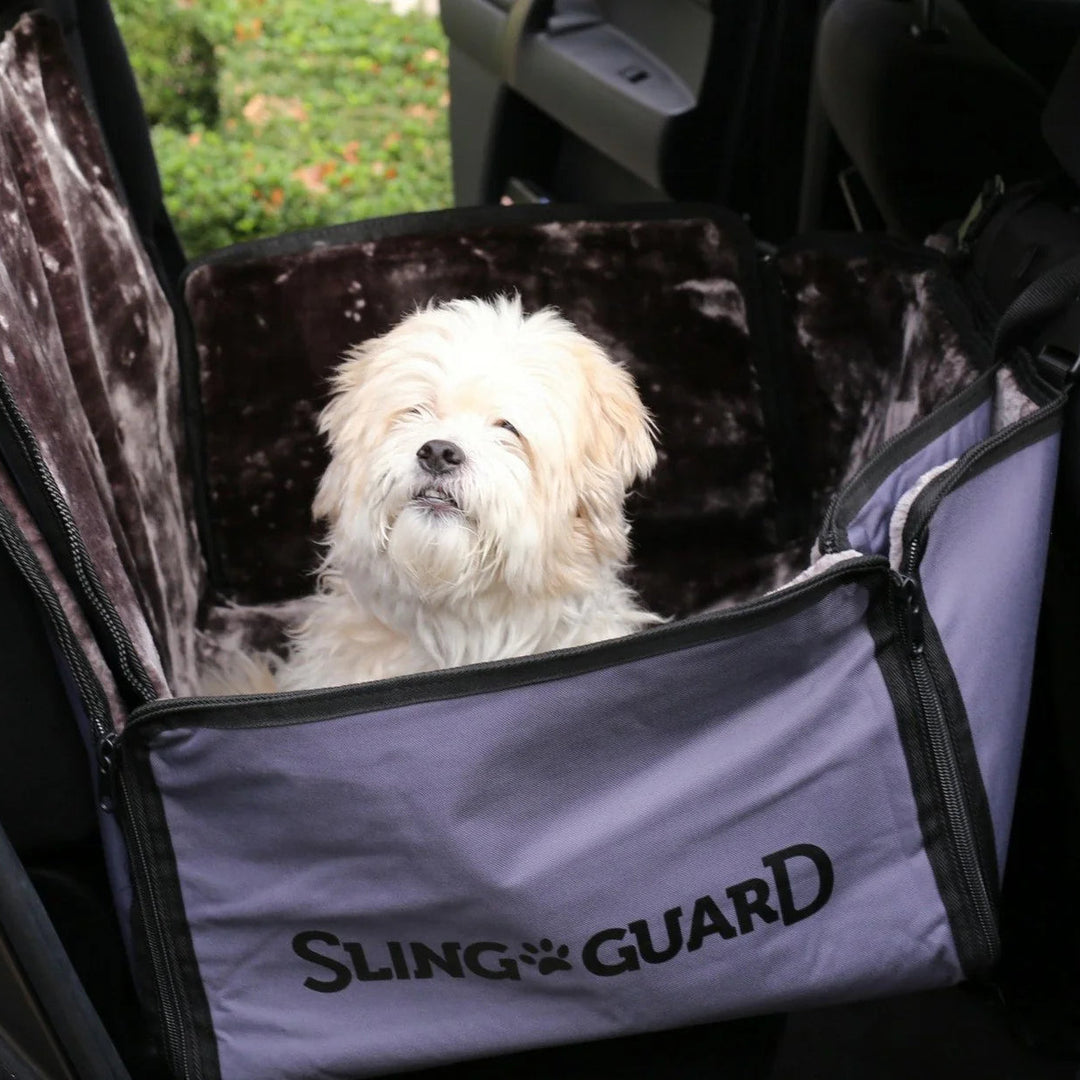 Dog inside a car with a Sling Guard pet seat cover.