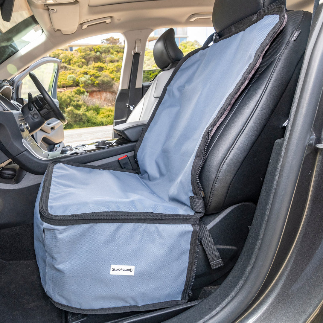 Car seat cover on a vehicle seat with a scenic background
