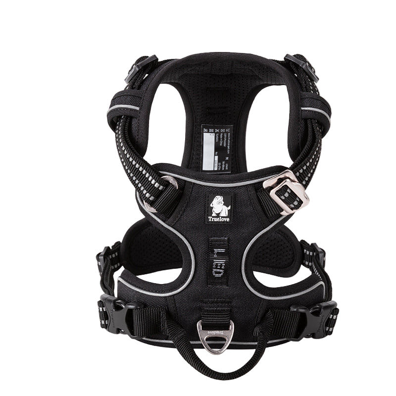 Black dog harness with reflective straps on a white background, featuring the Truelove brand logo.