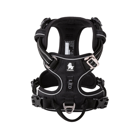 Black dog harness with reflective straps on a white background, featuring the Truelove brand logo.